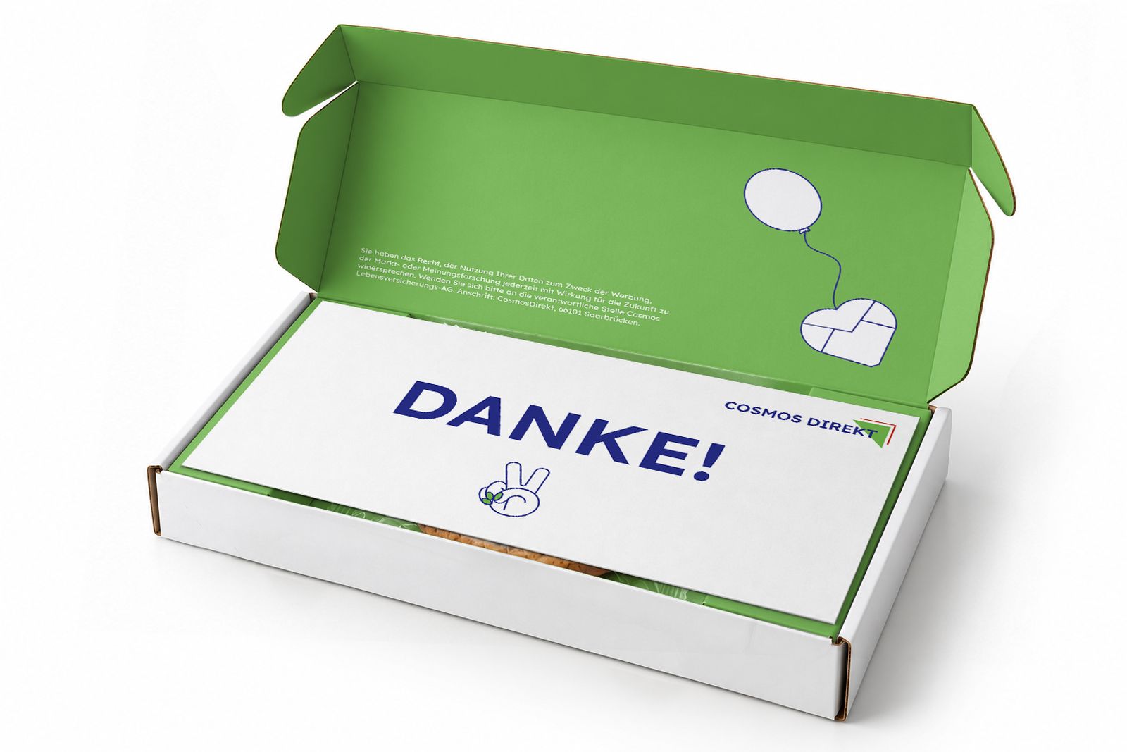 Geöffnete Box mit grüner Innenseite, obenauf die Dankeskarte
